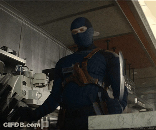 A Man In A Mask Is Standing In A Kitchen With The Words Daredevilshots Written On The Bottom GIF
