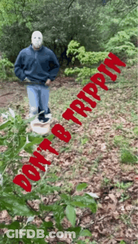 A Man In A Mask Is Standing In The Woods With The Words " Do N't B Trippin " Written In Red GIF