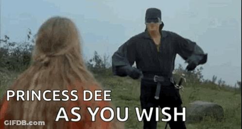 A Man In A Mask Is Standing Next To A Woman In A Field With The Words `` Princess Dee As You Wish '' . GIF