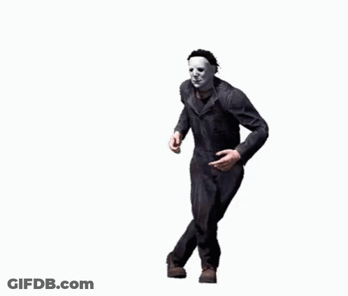 A Man In A Mask Is Standing On One Leg And Pointing . GIF
