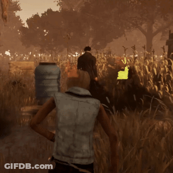 A Man In A Mask Stands In A Field Of Tall Grass GIF