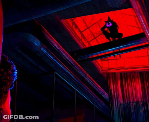 A Man In A Mask Stands In Front Of A Screen That Says " Emergency " GIF