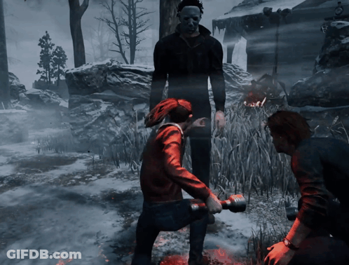 A Man In A Mask Stands Next To A Woman In A Red Jacket Holding A Hammer GIF