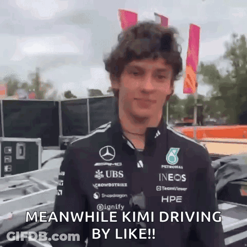 A Man In A Mercedes Shirt Says Meanwhile Kimi Driving By Like . GIF