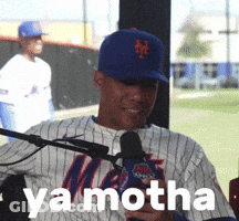 A Man In A Mets Jersey Is Talking Into A Microphone With Ya Motha Written On The Bottom GIF
