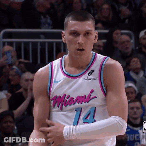 A Man In A Miami 14 Jersey Stands On The Court GIF