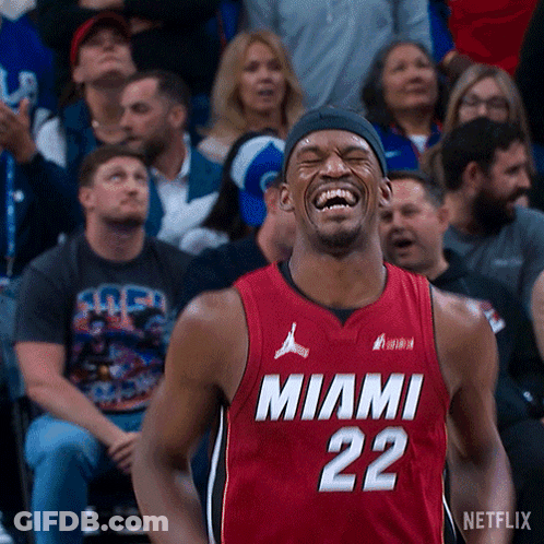 A Man In A Miami 22 Jersey Is Laughing GIF