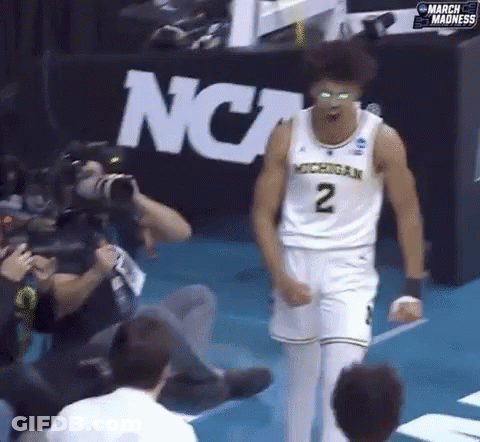 A Man In A Michigan Jersey With The Number 2 On His Chest GIF