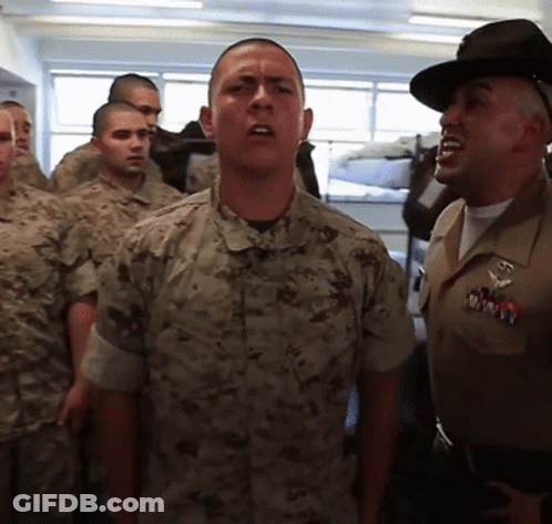 A Man In A Military Uniform Has A Badge That Says Marines On It GIF