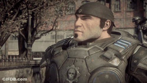 A Man In A Military Uniform Has A Gear With A Skull On It On His Chest GIF