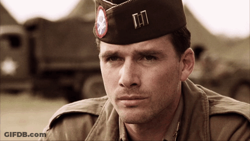 A Man In A Military Uniform Has A Hat With The Letters Tn On It GIF