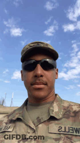 A Man In A Military Uniform Has A Patch That Says 2J3w On It GIF