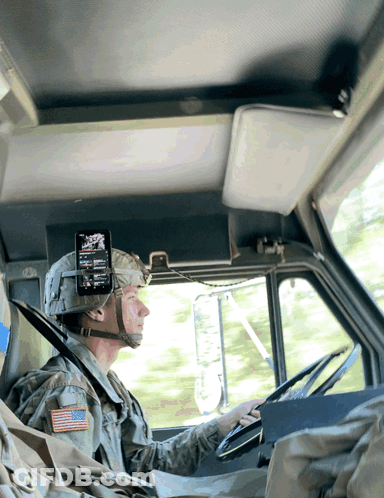 A Man In A Military Uniform Has An American Flag Patch On His Sleeve GIF