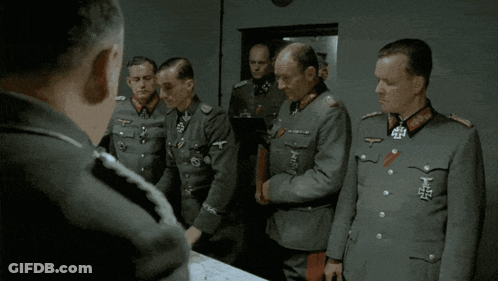 A Man In A Military Uniform Has The Letter T On His Shoulder GIF