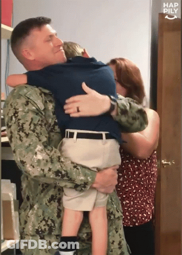 Man In Military Uniform Holding Child GIF