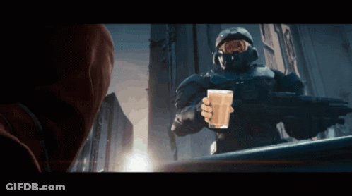 A Man In A Military Uniform Is Holding A Glass Of Milk GIF