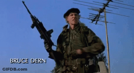 A Man In A Military Uniform Is Holding A Gun And The Name Bruce Dern Is On The Bottom GIF