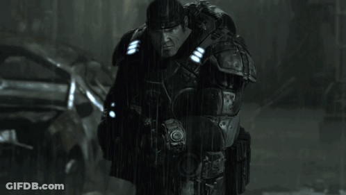 A Man In A Military Uniform Is Holding A Gun With A Blue Light On It GIF