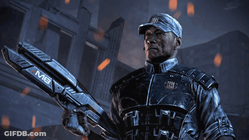 A Man In A Military Uniform Is Holding A Large Gun That Says Mb On It GIF