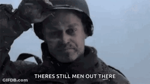 A Man In A Military Uniform Is Holding His Helmet Over His Head And Says `` There 'S Still Men Out There '' . GIF