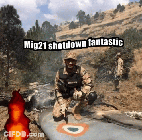 A Man In A Military Uniform Is Kneeling Next To A Plane With The Caption Mig21 Shot Down Fantastic GIF