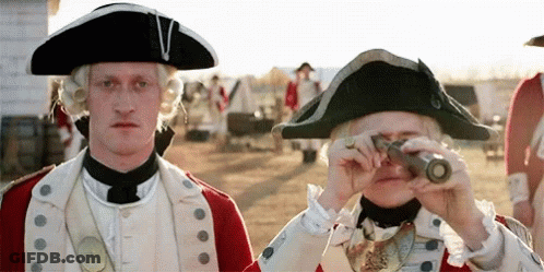 A Man In A Military Uniform Is Looking Through A Telescope . GIF