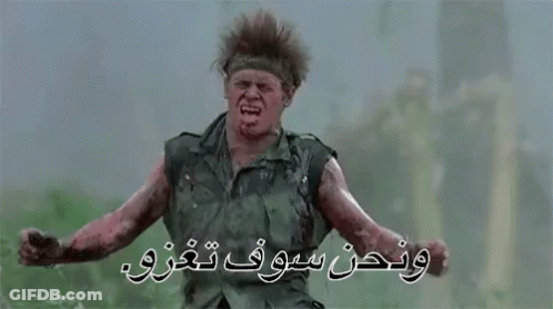A Man In A Military Uniform Is Making A Funny Face While Standing In A Field With His Arms Outstretched . GIF
