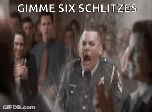 A Man In A Military Uniform Is Screaming In Front Of A Crowd With The Words Gimme Six Schlitzes Written On The Bottom GIF