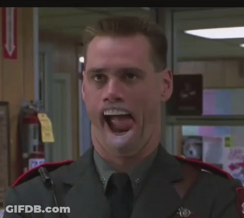 A Man In A Military Uniform Is Smiling And Making A Funny Face GIF