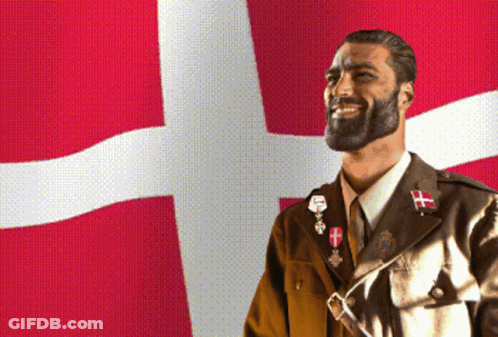 A Man In A Military Uniform Is Smiling In Front Of A Red White And Blue Flag GIF