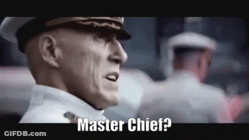 A Man In A Military Uniform Is Standing In Front Of A Crowd And Says Master Chief ? GIF