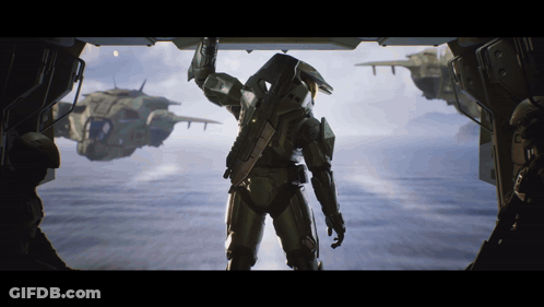 A Man In A Military Uniform Is Standing In Front Of A Window GIF