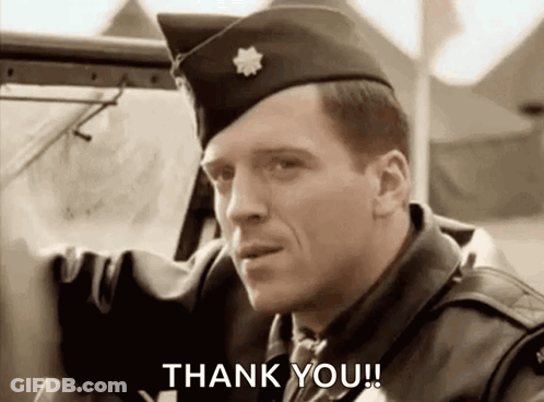 A Man In A Military Uniform Is Standing Next To A Car And Says `` Thank You '' . GIF