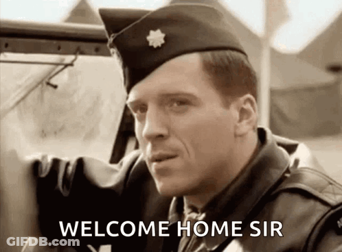 A Man In A Military Uniform Is Standing Next To A Car And Says Welcome Home Sir GIF