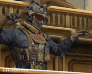 A Man In A Military Uniform Is Standing On A Balcony GIF