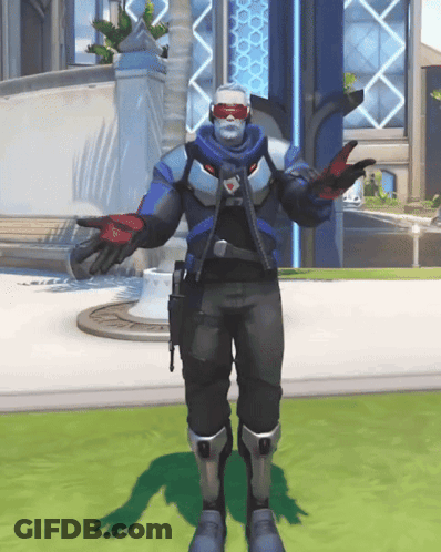A Man In A Military Uniform Is Standing On A Grassy Field GIF