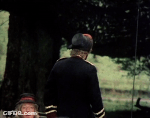 A Man In A Military Uniform Is Talking To Another Man In A Car GIF