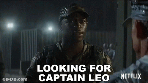 A Man In A Military Uniform Is Talking To Another Man In A Dark Room And Says `` Looking For Captain Leo '' . GIF