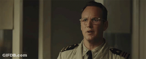 A Man In A Military Uniform Is Wearing Glasses GIF
