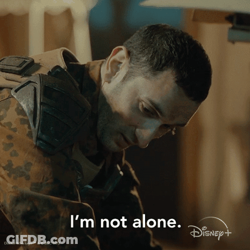 A Man In A Military Uniform Says " I 'M Not Alone " In A Disney + Ad GIF