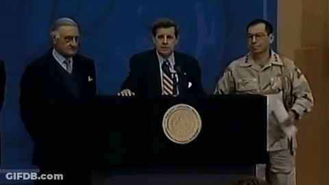 A Man In A Military Uniform Stands At A Podium GIF