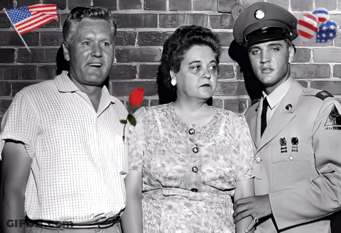 A Man In A Military Uniform Stands Next To A Man And Woman GIF