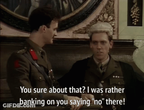 A Man In A Military Uniform Talks To Another Man In A Suit GIF