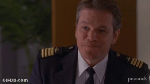A Man In A Military Uniform With Peacock Written On The Bottom Right GIF