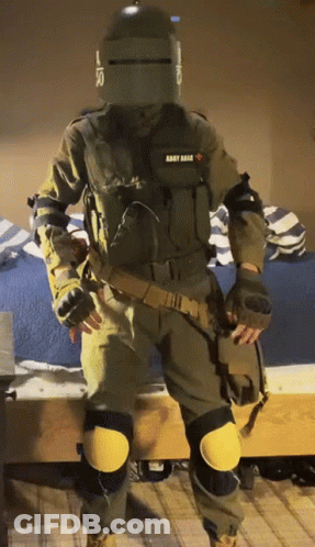 A Man In A Military Uniform With The Word Army On The Back GIF