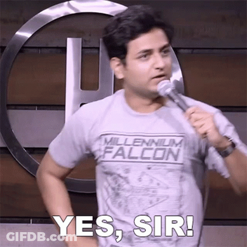 A Man In A Millennium Falcon Shirt Is Holding A Microphone And Says Yes Sir GIF