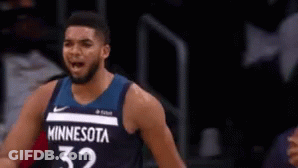 A Man In A Minnesota 32 Jersey Stands On The Court GIF