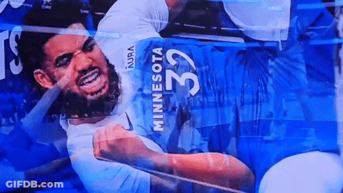 A Man In A Minnesota Jersey With The Number 32 On The Back GIF