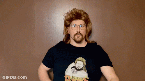 A Man In A Mullet And Glasses Is Wearing A Shirt That Says " Bill Riga " GIF