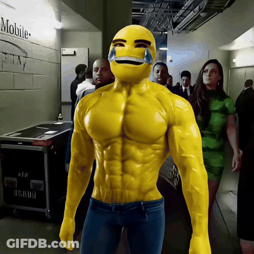 A Man In A Muscle Suit Is Standing In A Hallway With A Mobile Sign On The Wall Behind Him GIF